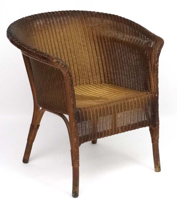 W Lusty & Sons Ltd - A Lloyd Loom armchair. Labelled.