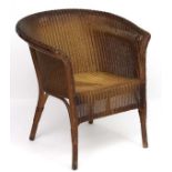 W Lusty & Sons Ltd - A Lloyd Loom armchair. Labelled.