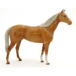 A Beswick model formed as a Palomino Hunter horse , number 1734 in gloss finish,