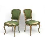 A pair of Continental 18thC upholstered single chairs.