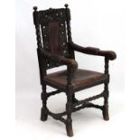 A William and Mary Revival oak chair with embossed leather seat,