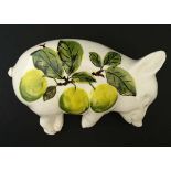 Wemyss : A Brian Adams Exon Pottery Wemyss ware figure of a sleeping pig,