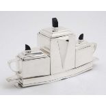 A 21st Century Art Deco style Silver Plate Tea Set , comprising of a Tea Pot ,