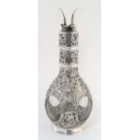 A glass four sectional decanter / cordial flask encased in silver foliate overlay with four