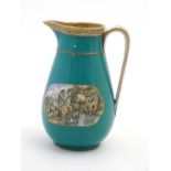 A 19thc Prattware jug decorated with lozenge shaped rural scenes,