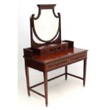 A mahogany strung dressing table with shaped bevelled edged mirror 44 3/4" wide x 63 1/2" high x 22