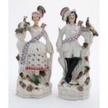 A pair of 19thC Victorian Staffordshire figure groups of male and female archers,
