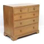 A bleached mahogany chest of drawers comprising 2 short over 3 graduated long drawers Robinson & Co