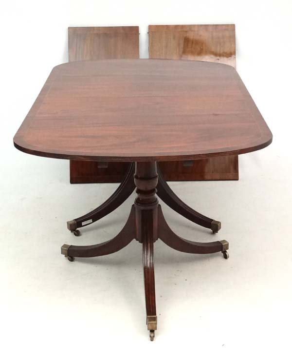 A 20thC mahogany Regency twin pedestal 2 leaf extending dining table 37" wide x 97" long - Image 3 of 3