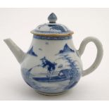 A Chinese blue and white teapot decorated to sides with figure in a boat fishing on a lake in a
