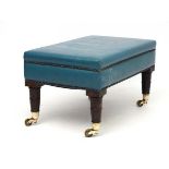 An 18thC style leather upholstered four legged stool on castors.