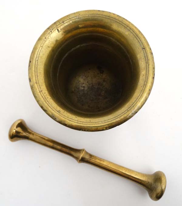 A 19thC brass Apothecary's pestle and mortar. The Mortar 4'' high. - Image 4 of 4