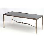 Mid Century / Hollywood Regency : a gilded brass coffee table with black top 36" long x 18 1/4"
