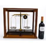 Griffin & George LTd : A mahogany and glass cased set of scientific balance scales.