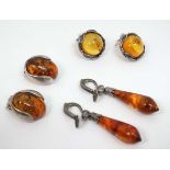 3 pair of assorted amber silver and white metal earrings (3) CONDITION: Please Note