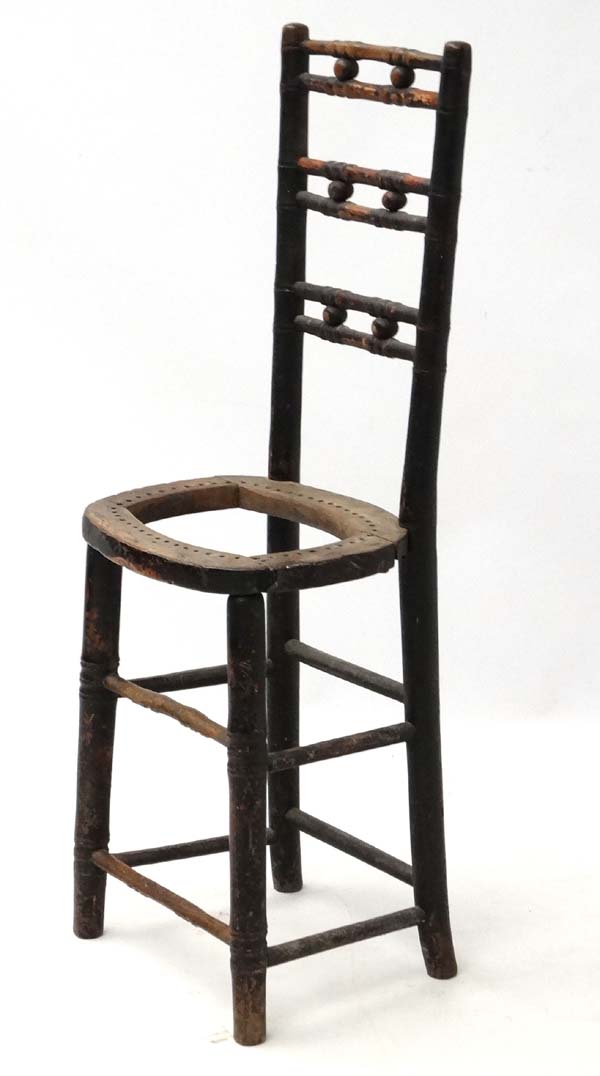 A 19thC ebonised faux bamboo Mendlesham correctional chair 35" high CONDITION:
