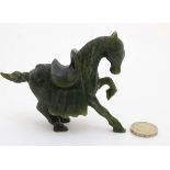 A Chinese spinach green carving of a horse 3 1/8" high x 4" long CONDITION: Please