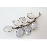 A white metal brooch set with moonstone cabochon 2 ¼” long CONDITION: Please Note