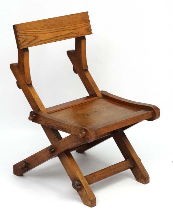 A 19thC elm Glastonbury style single chair 32" high x 22" wide x 25 1/2" deep CONDITION: