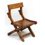 A 19thC elm Glastonbury style single chair 32" high x 22" wide x 25 1/2" deep CONDITION:
