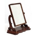 A Victorian mahogany toilet mirror on shaped base.