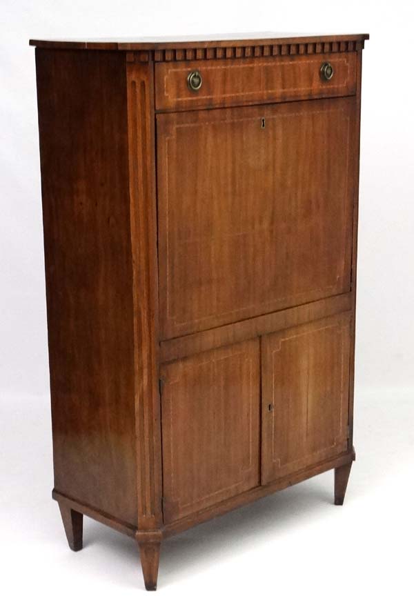 An early 19 thC Continental Mahogany Escritoire / Secretaire a Abbatant with canted corners and