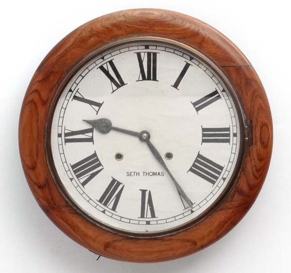 Seth Thomas 12" wall Clock : a walnut cased 8 day wall clock, formerly striking on two gongs,