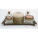 A 1950's dressing table set comprising pots and jars on a mirrored stand .