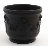 A early / mid 19thC Black Basalt '' Wedgwood '' pot decorated with lions masks with hanging swags