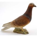 A Beswick Racing Pigeon , model number 1383B, designed by Mr Orwell , in red matt finish ,