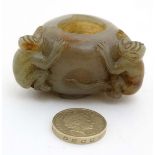 A jade brush pot in the form of a large peach with 2 monkeys approx 2 1/8" CONDITION: