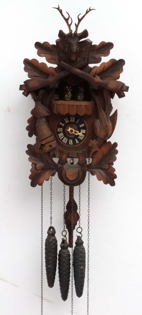 Black Forest Cuckoo Clock : a Three train Guiessaz-Jaccard Swiss Musical Movement wall clock with 4