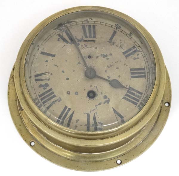 Clock : a brass cased ship's / submarine 6 5/8" wall timepiece Clock With fast- slow at 12 and
