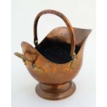 A late 19thC copper with brass handled helmet shaped coal scuttle 12 1/2" jhigh