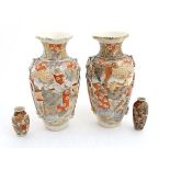 Two c1920s miniature earthenware Satsuma vases, each hand decorated with figures.