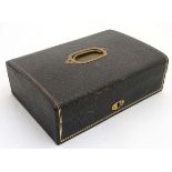 A 19thC leather covered travelling box / ladies vanity box opening to reveal mirror and fitted