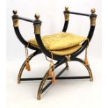 Mid Century / Hollywood Regency : A black and gilt Roman style Curule chair/ Piano stool with
