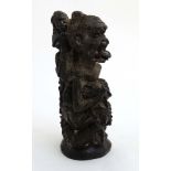 Ethnographica : A Native Tribal : An East African ebony carving of a figure and various smaller