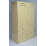 A Victorian painted pine linen press comprising 2 cupboard doors over 2 short and 2 long drawers,