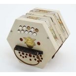 Musical Instruments : A mid 20thC Concertina / Squeezebox / Accordion by Araldo ,