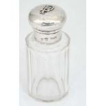 A cut glass scent bottle with silver top hallmarked London 1900 3 1/2" high CONDITION: