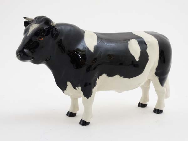 A Beswick model formed as a Friesian Bull '' Champion Coddington Hilt Bar '',