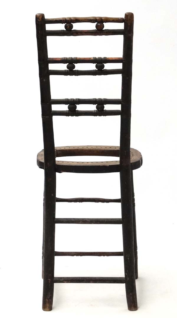 A 19thC ebonised faux bamboo Mendlesham correctional chair 35" high CONDITION: - Image 3 of 4