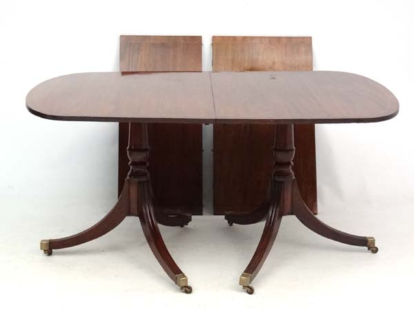 A 20thC mahogany Regency twin pedestal 2 leaf extending dining table 37" wide x 97" long