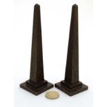 A pair of 1919 small brass obelisks with hieroglyphics and sanscrit / Arabic script to sides.