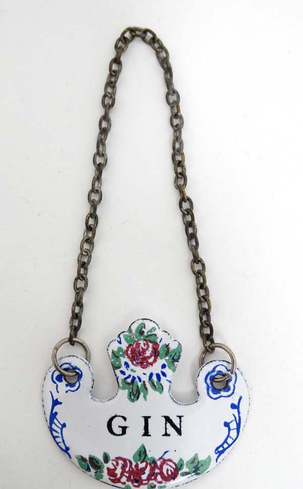 A French enamel wine / decanter label with hand painted decoration CONDITION: