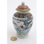 A small Chinese famille rose baluster lidded vase , decorated with figures and goats,