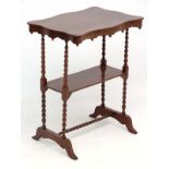 A 19thC mahogany serpentine topped shaped etage with two tier and bobbin turned stretchers.