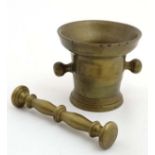 A 20thC brass Apothecary's pestle and mortar. The Mortar 4 1/4'' high.