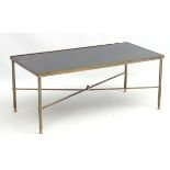 Mid Century / Hollywood Regency : a gilded brass coffee table with black top 36" long x 18 1/4"